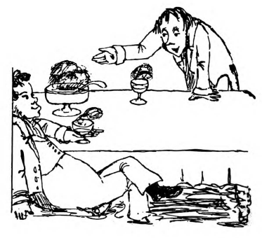 One man is lying in front of a table, a glass in his hand, another man is leaning on it.