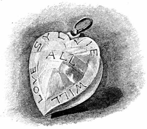 A locket in shape of a heart, with “Sylvie will love all” written on it, spiralling from top to the middle.