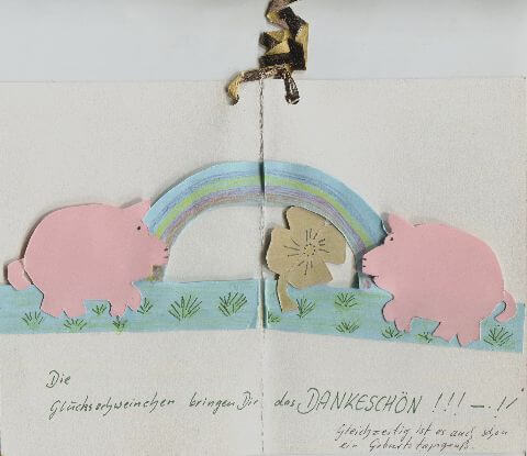 Karte mit Glücksschweinchen, Regenbogen, Kleeblatt und dem folgenden Text